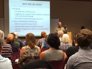 Photo of USFS Deputy Forest Supervisor Tom Torres leading a public meeting